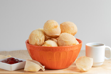 Brazilian snack cheese bread (pão de queijo) served with coffee.