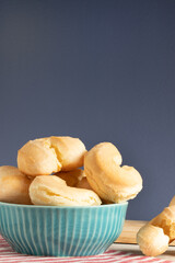 Cheese biscuit (biscoito de queijo). Brazilian traditional snack in blue bowler.