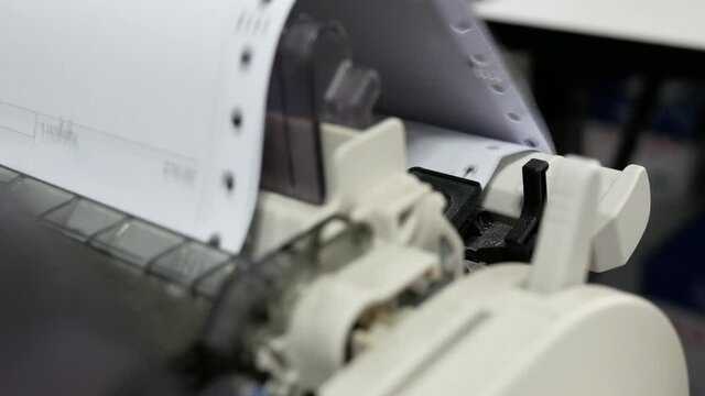 closeup of continuous paper printer in the office,selected focus.
