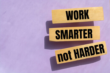 Work Smarter not harder words phrase on Wooden blocks. High salary, business profit or self motivation concept.