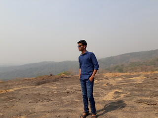 man in the mountains, young boy hiking in the mountains, Sanjay Gandhi National Park.