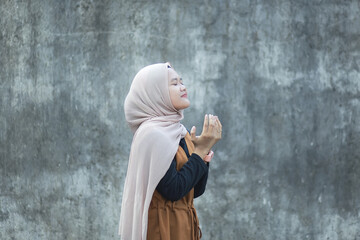 Beautiful young asian muslim praying gesture