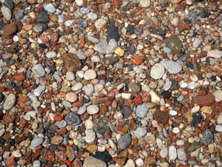 View of Colored Pebbles through the water