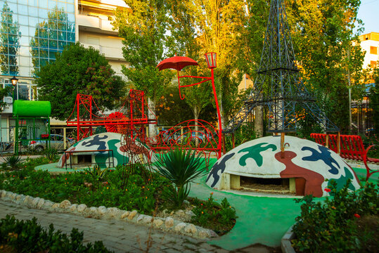 VLORA-VLORE, ALBANIA: Colorful bunkers have become the decoration of the yard.