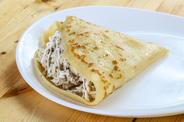 Pancake with chicken and sause