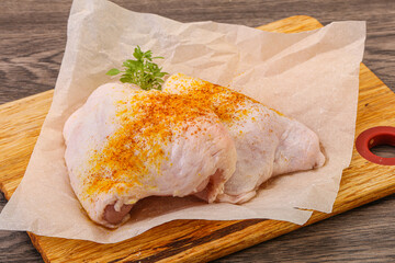 Raw chicken thigh with spices