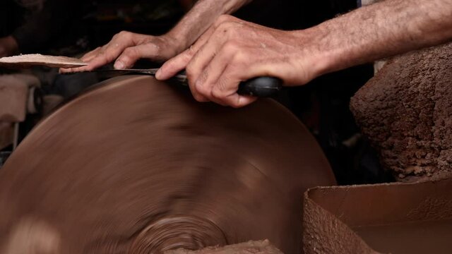 Old-fashioned way of knife sharpening with a grinding stone. Handicraft work in the Medina of Marrakech, Morocco.