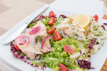 Seafood salad with salmon and vegetables