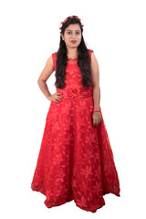 Young girl in red dress posing on white background