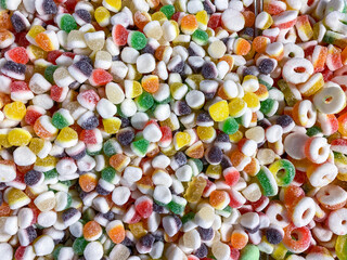 Closeup background from colorful sweets of sugar candies. Assortment tasty gummy