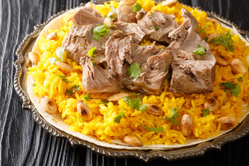Mansaf is a dish of rice, lamb, and a dry yoghurt made into a sauce called jameed closeup in the...