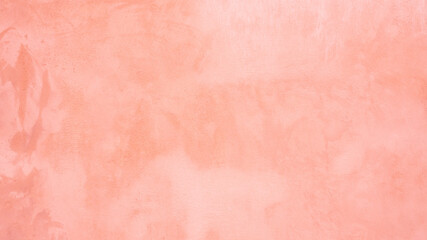 Blurred red texture on stucco.