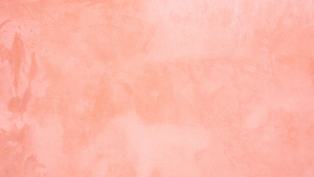 Blurred red texture on stucco.