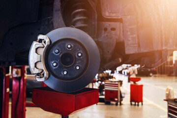 disc brake of the vehicle for repair. car repairing in garage