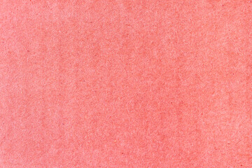 A sheet of red colored paper. Rough smooth texture.