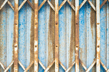 steel folding door Blue sliding exterior with steel plate lock and thick steel door inside, rusty steel.