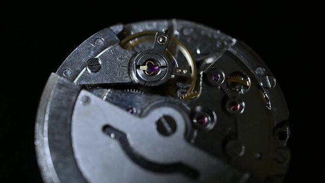 watch movement on black background