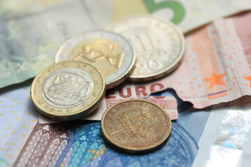 Greek coins on euro notes
