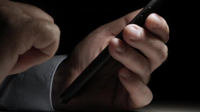One Man Text on a Cell Phone, Send and Receive Messages Using Internet. Using a Mobile Phone Late, at Night.
