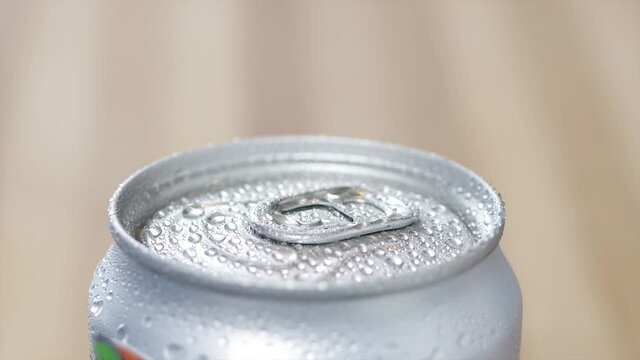 Shooting with a Cold Refreshing Drink Unopened. Refreshing Soda Pop Can Drink.