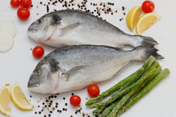 fresh fish with lemon and vegetables