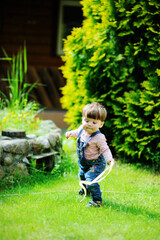 Adorable baby girl making her first steps