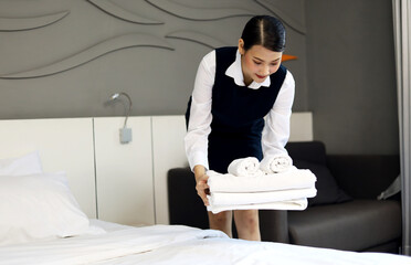 Employees woman are cleaning hotel rooms during the holidays.