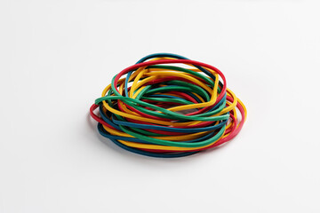 Heap of colored rubber bands on white background