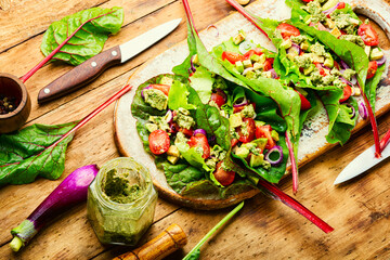 Spring vegetable salad in chard leaves