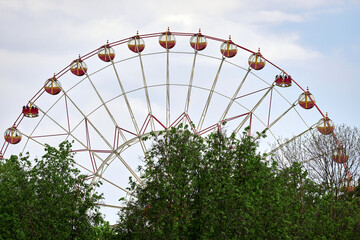 Big Ferris wheel in the City Park. Attraction and entertainment.