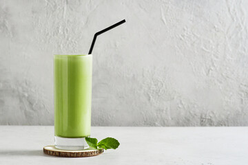 Green smoothie mint or matcha latte in tall glass