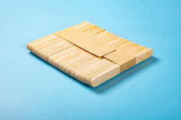 bunch of popsicle sticks on a blue backgrond