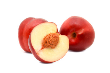 Raw ripe nectarine fruits in group cutted into half and whole isolated on white
