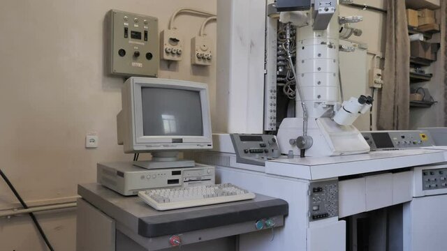 Retro, Old Fashioned Computer and Electronic Microscope In Research Laboratory