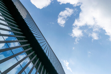 Fototapeta na wymiar Business building. Modern office business building with glass, steel facade exterior. Finance corporate architecture city in abstract blue sky with nature cloud in sunny day.