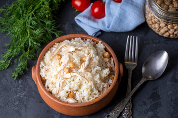 Traditional delicious Turkish food; Rice with chickpeas and chicken (Turkish name; Tavuklu nohutlu pilav or pilaf)