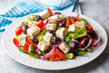 Greek salad with fresh vegetables, feta cheese and kalamata olives. Healthy food.