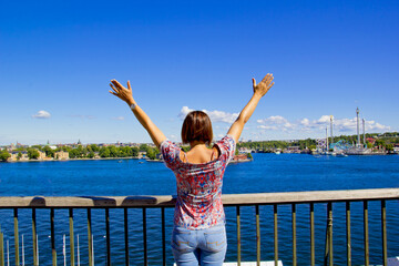 beautiful woman looking to view of stockholm in Sweden