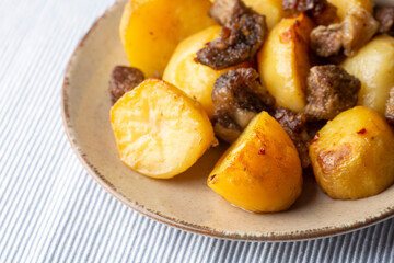 From traditional delicious Turkish food; potato and meat dish in casserole (Turkish name; Guvec tas kebabi)