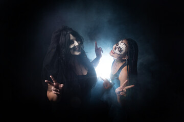 Supernatural entities, portrait of two supernatural entities, artistic makeup, black background, Low Key portrait, selective focus.