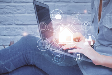 Double exposure of woman hands typing on computer and buildings drawing. Smart-city concept.