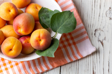 Fresh apricot fruit on the wooden background