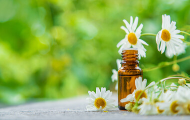 Essential oil extract of medicinal chamomile. Selective focus.