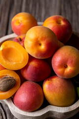 Fototapeta na wymiar Fresh apricot fruit on the wooden background