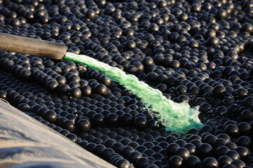 East Kazakhstan region, Kazakhstan - 12.02.2015 : The chemical tank is covered with plastic balls...