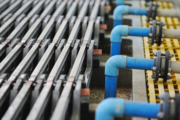 East Kazakhstan region, Kazakhstan - 12.02.2015 : The metal hoists are arranged in a row in the copper cathode cleaning compartment.