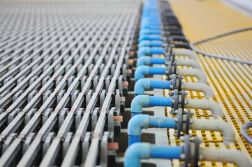 East Kazakhstan region, Kazakhstan - 12.02.2015 : The metal hoists are arranged in a row in the copper cathode cleaning compartment.