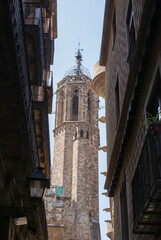 Fototapeta na wymiar Old historic European narrow street with a church. Medieval architecture.