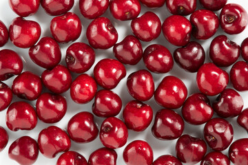 Red cherries on white, design for backgrounds and textures