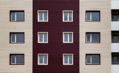 Facade of multistory apartment house. Urban landscape. Block of flats.